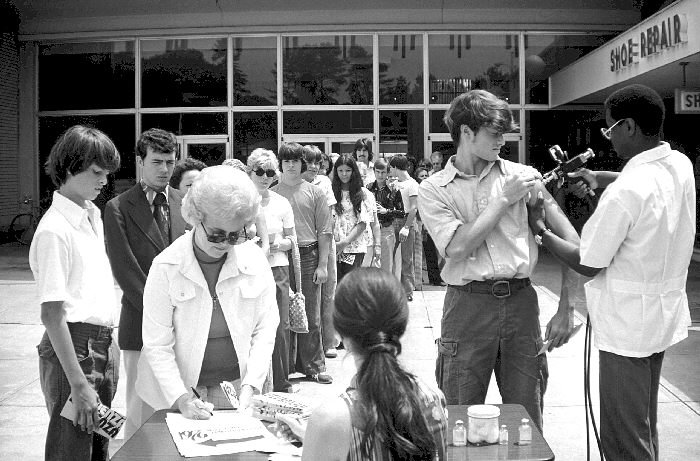1976-swine-flu-black-white-line-people-New-Jersey A black and white photo showing a line of people in waiting to receive the 1976 swine flu vaccine.