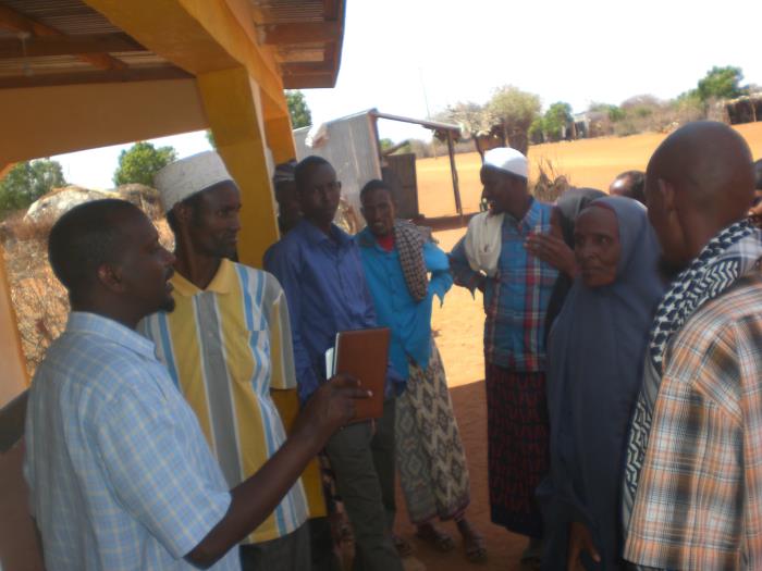 Kenyan (FETP) resident Adam Haji with Tula Tula Village elders. 