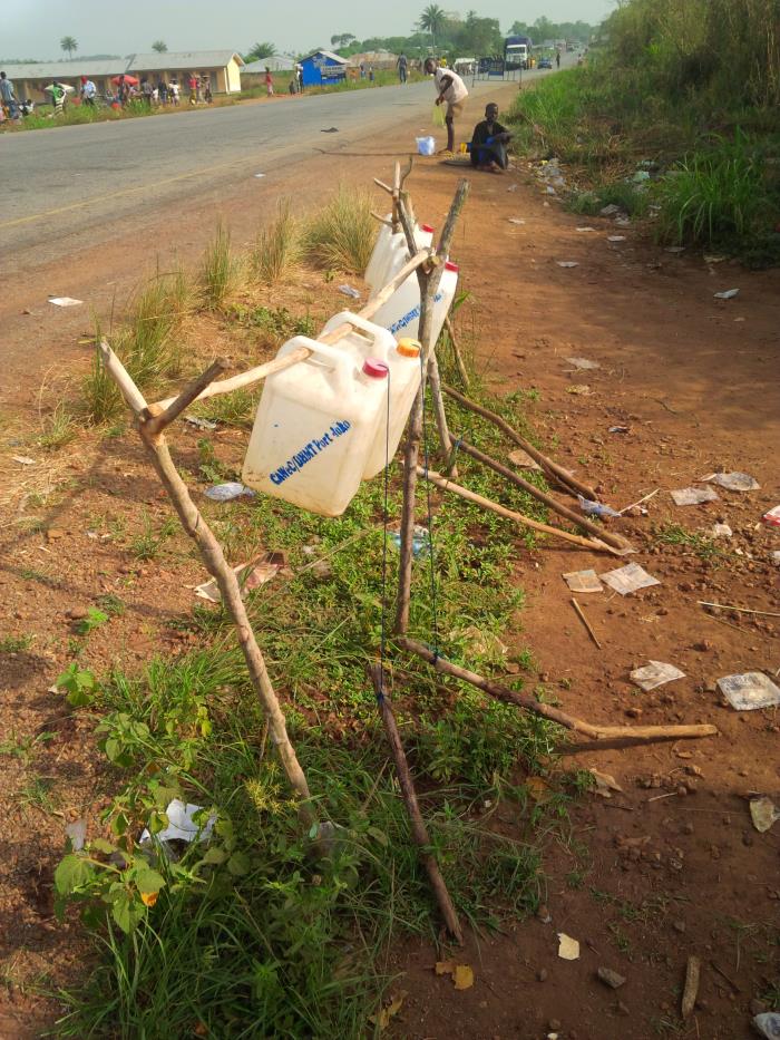 Centers for Disease Control and Prevention (CDC) Entomologist, Seth Irish, examining a discarded water bottle