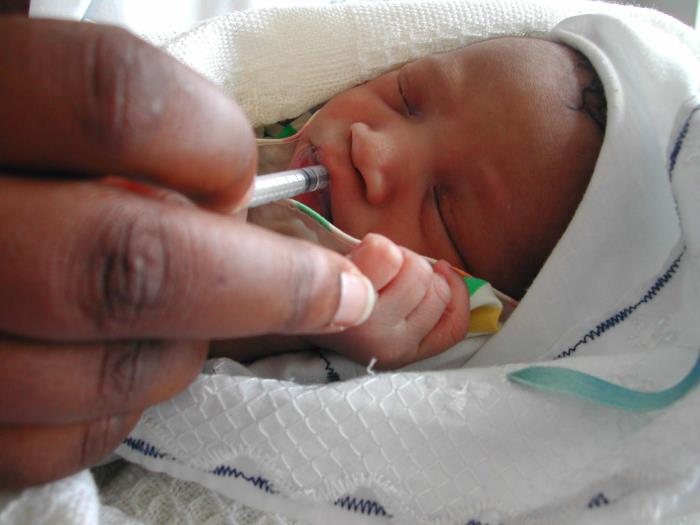 Newborn receiving vaccine